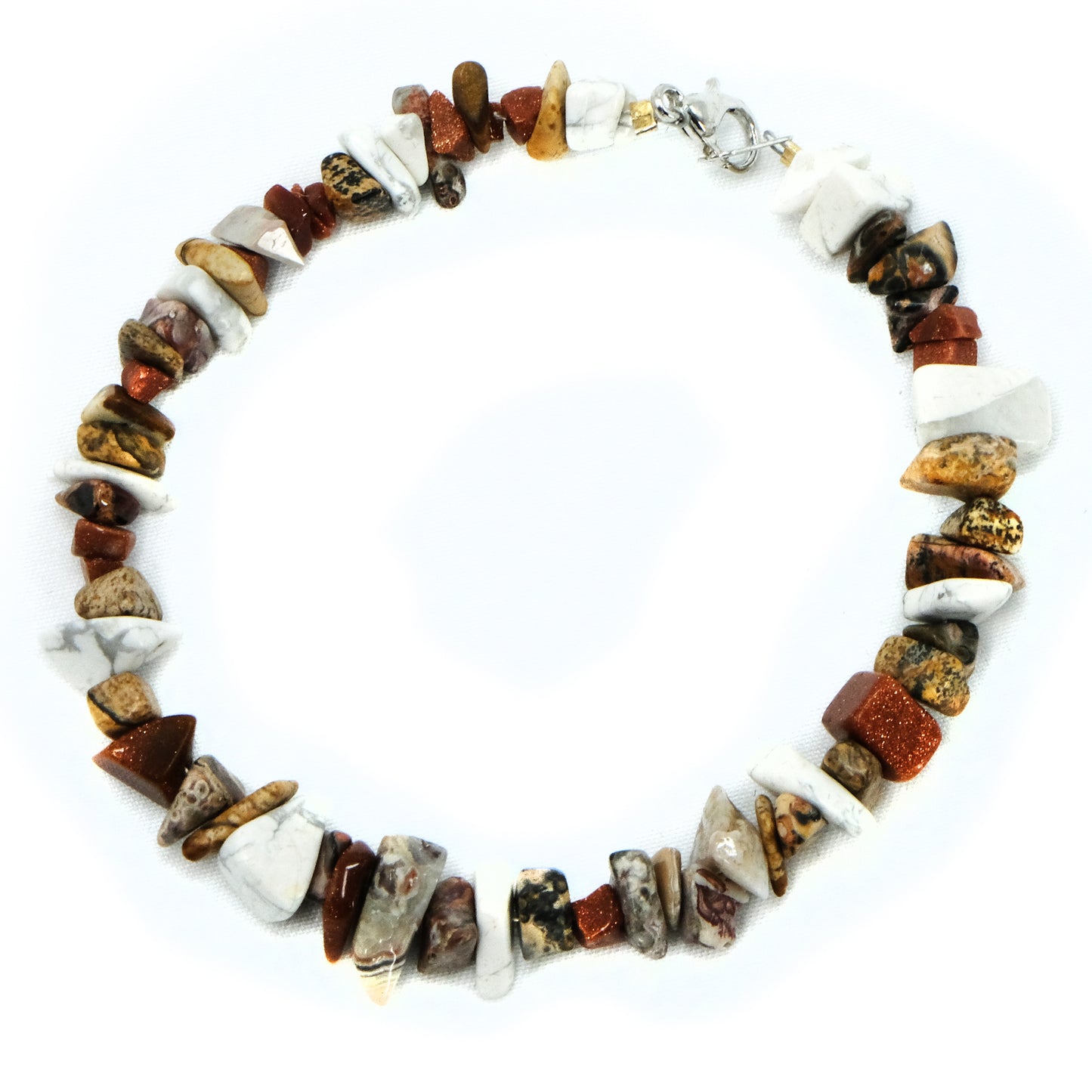 Chipped semiprecious beaded bracelet. Silver clasp. Tigereye, garnet, amethyst, topaz, lapis, aquamarine, agate, howlite, goldstone